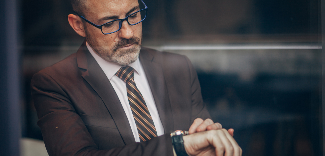 business man checking watch.jpg