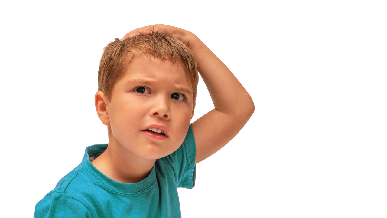 head-lice-young-boy-scratching